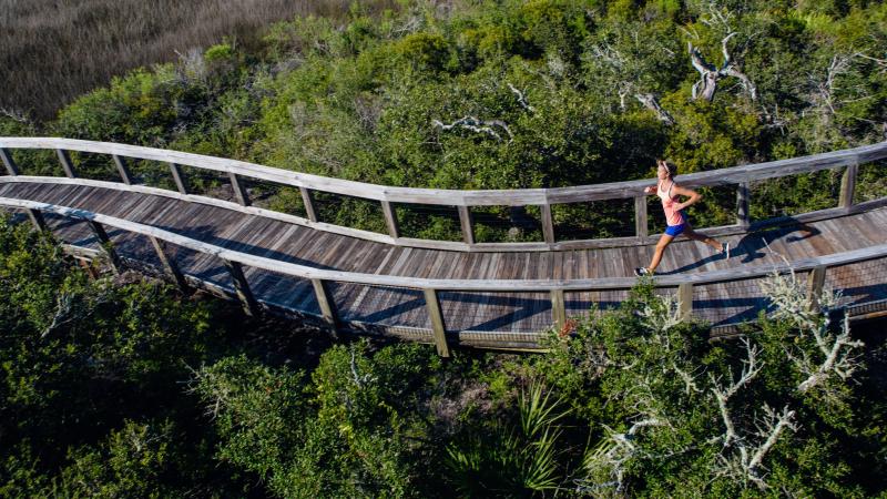 Runner on curving Boardwalk